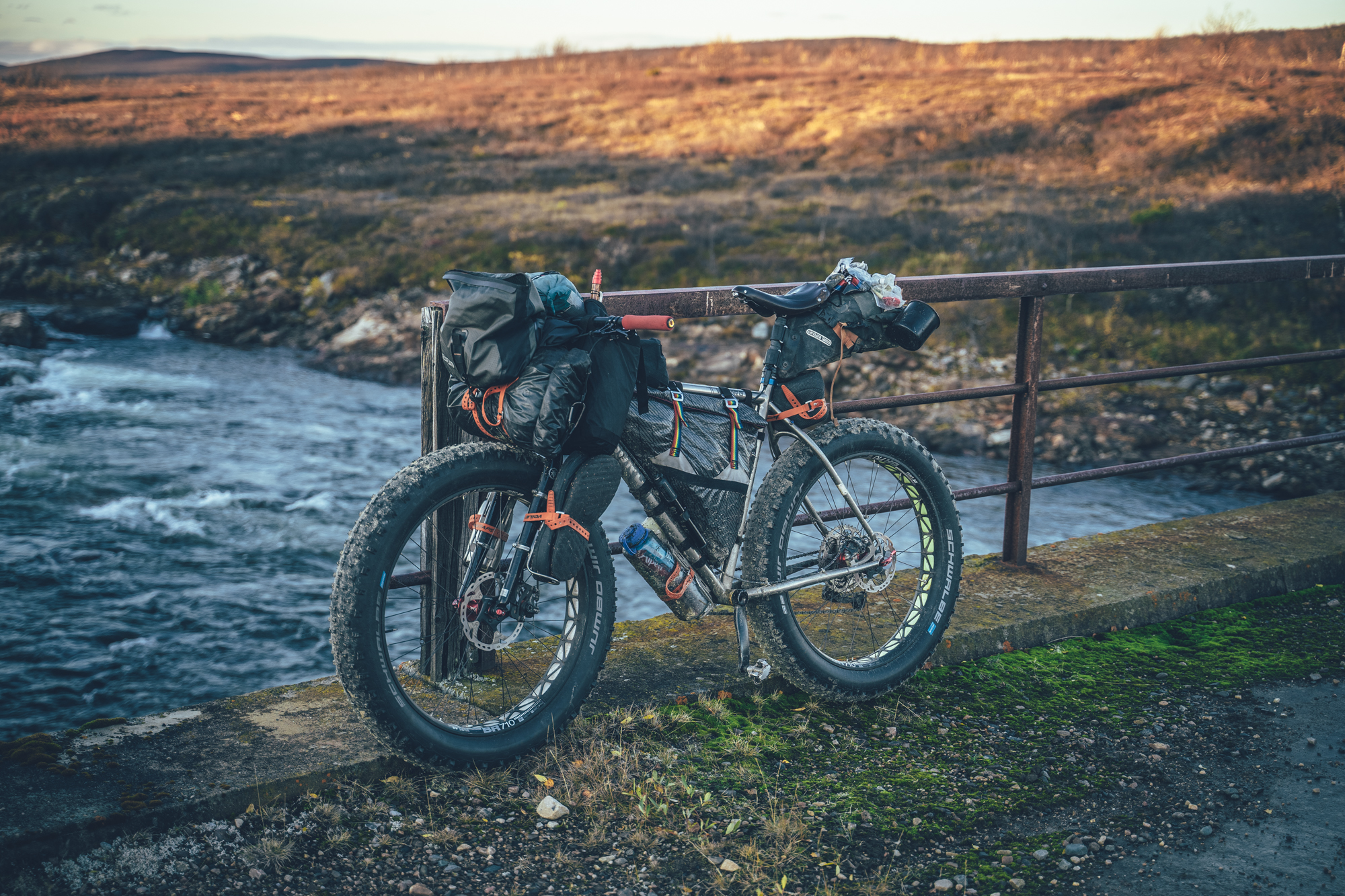 bike on a bridge in full bikepacking set up