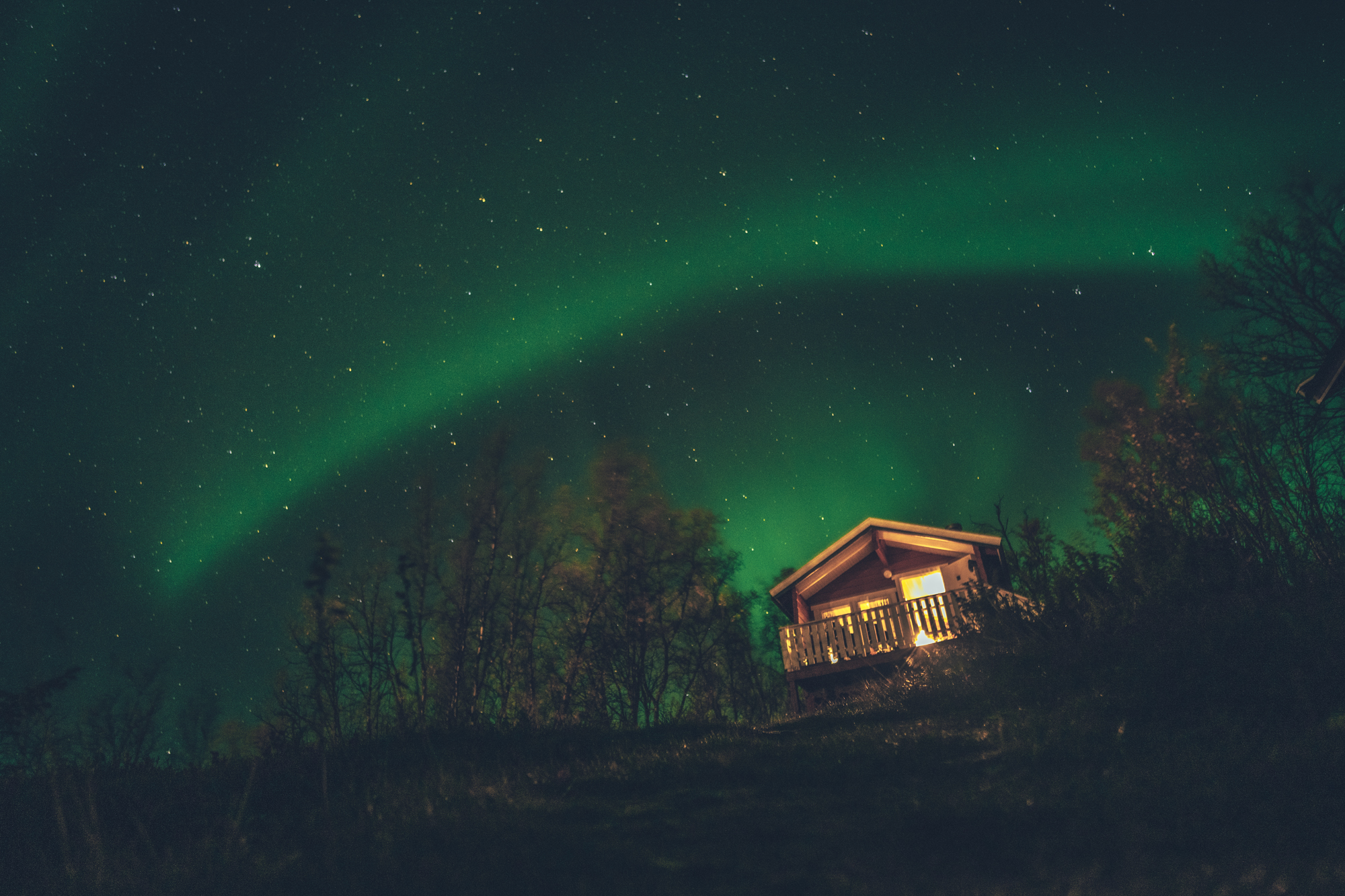 northern lights above a cabin