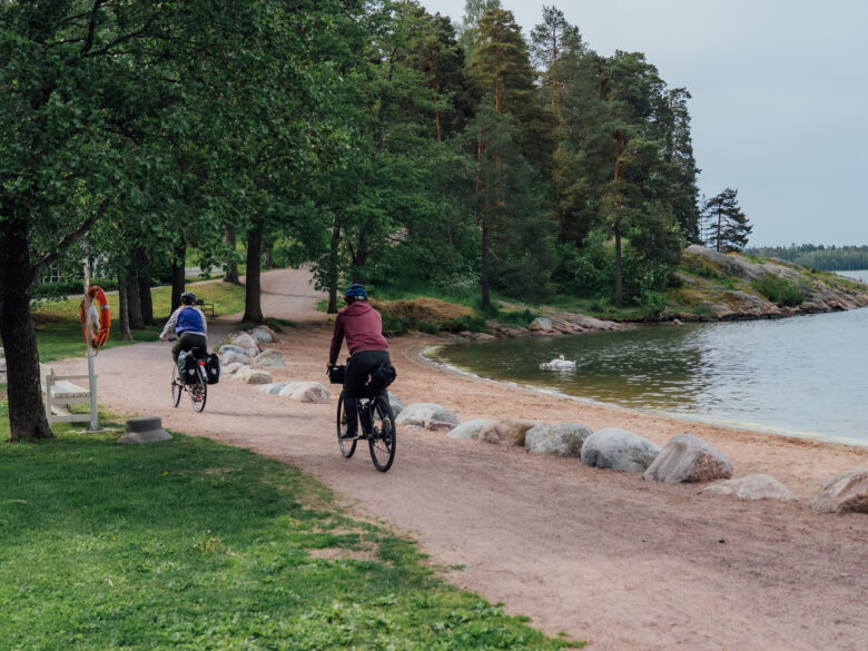 bikers next to a beach