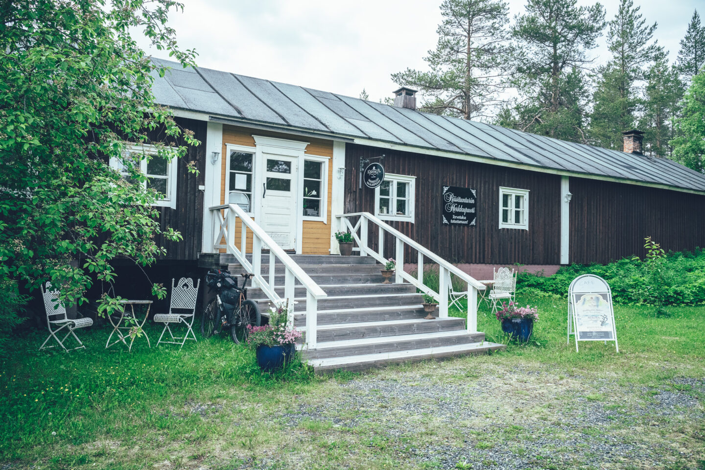 old wooden house with a cafe